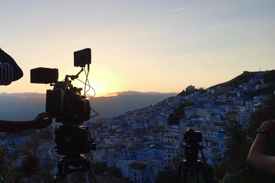 Cameras on tripods overlooking Chefchaouen at sunset