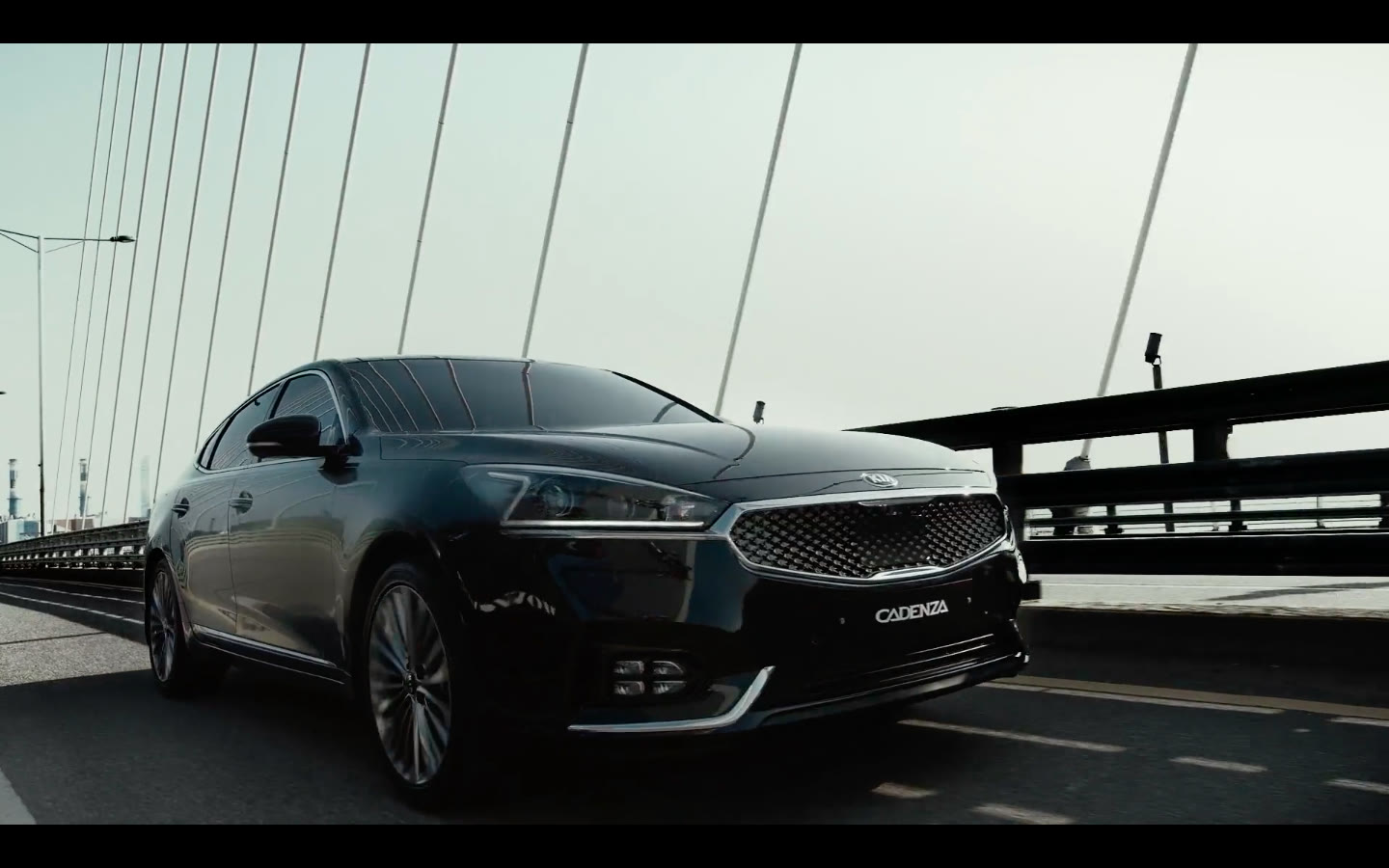 Kia Cadenza on a daylight bridge, from a Luminous US commercial